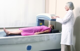 Bone Mineral Density (BMD) calculator - Woman Receiving Dexa-scan with providers-scaled