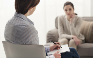 Cognitive Behavioral Therapy (CBT) - Image of a Dr. and a patient talking in consult